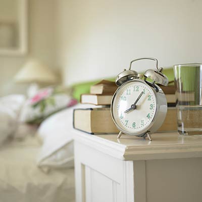 Stick to a structured routine clock beside bed