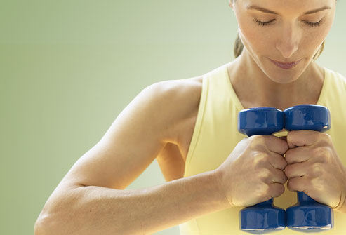 Managing Fibromyalgia: Exercise photo of woman with hand weights