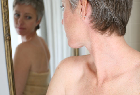 Fibromyalgia: The Pain Is Real woman looking in mirror